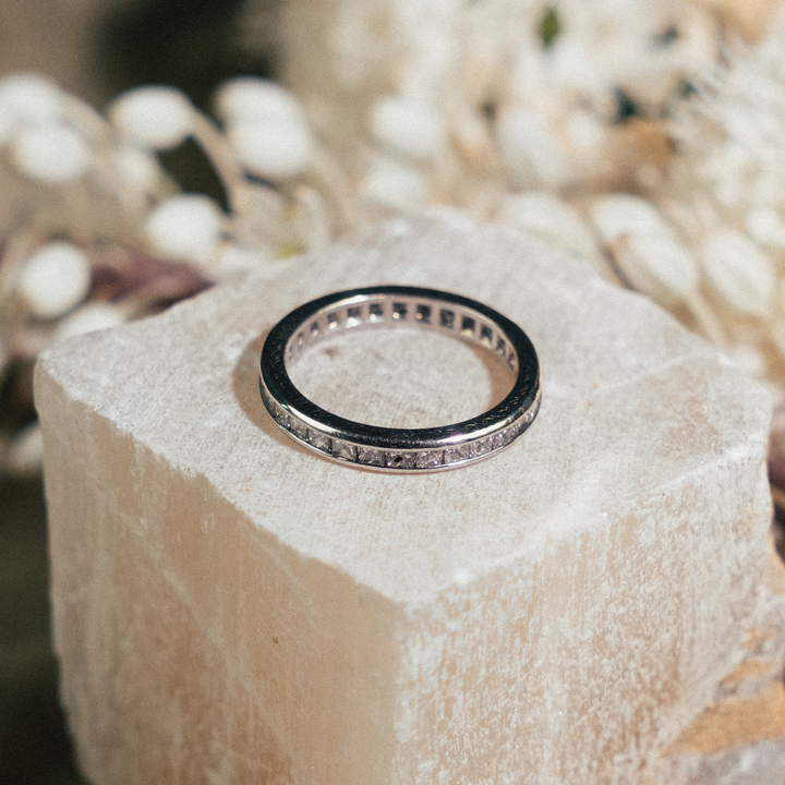 Platinum Princess Cut Channel Eternity Band - Consider the Wldflwrs