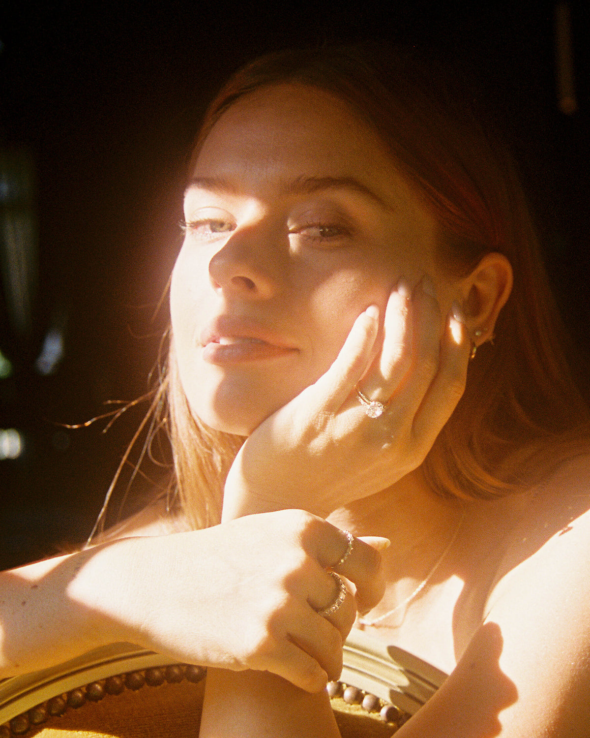 Image Of Woman Wearing Custom Engagement Rings, Wedding Bands, And 14K Solid Gold Fine Jewelry